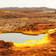 Hydrothermal lake at the Danakil Depression featuring sulfates (yellow) and iron oxide deposits (red). Image: Felipe Gomez/Europlanet 2020 RI